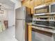 View of a kitchen showcasing stainless steel appliances and connection to dining area, blending functionality and style at 2442 Enterprise Rd # 6, Clearwater, FL 33763