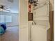 Convenient laundry setup with stacked washer and dryer adjacent to the bedroom at 2442 Enterprise Rd # 6, Clearwater, FL 33763