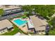 Aerial view of the community pool featuring plenty of lounge seating and a patio area at 2442 Enterprise Rd # 6, Clearwater, FL 33763
