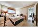 A bedroom is shown with a floral theme and plant accent offering a soothing and personal space at 2817 Rustic Oaks Dr, Palm Harbor, FL 34684