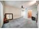Bedroom features a ceiling fan, carpet and is brightly lit at 2817 Rustic Oaks Dr, Palm Harbor, FL 34684