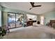 The living room has sliding glass doors with access to the outside at 2817 Rustic Oaks Dr, Palm Harbor, FL 34684