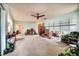 This spacious living room has a ceiling fan and carpet at 2817 Rustic Oaks Dr, Palm Harbor, FL 34684
