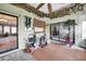 This sunroom features decor and plants to offer a sun-kissed retreat inside this home at 2817 Rustic Oaks Dr, Palm Harbor, FL 34684