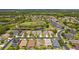Wide aerial shot capturing the community's serene setting and multiple ponds at 3013 Silvermill Loop # O, Land O Lakes, FL 34638