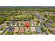 Aerial view shows the home's location amidst ponds in the Primary-planned neighborhood at 3013 Silvermill Loop # O, Land O Lakes, FL 34638