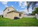 Large backyard features lush green grass and a partial fence, offering a private outdoor space at 3013 Silvermill Loop # O, Land O Lakes, FL 34638