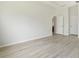 Spacious, neutral bedroom featuring hard wood flooring at 3013 Silvermill Loop # O, Land O Lakes, FL 34638