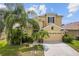 Charming home with a two-car garage, beautiful landscaping, and well-maintained lawn at 3013 Silvermill Loop # O, Land O Lakes, FL 34638