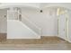Open foyer with tile and wood floors, a staircase and soaring ceilings at 3013 Silvermill Loop # O, Land O Lakes, FL 34638