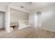 Bright hallway with hardwood floors, white walls and trim, and access to the staircase at 3013 Silvermill Loop # O, Land O Lakes, FL 34638