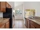 Kitchen showcasing granite counters, stainless steel appliances and ample cabinet space at 3013 Silvermill Loop # O, Land O Lakes, FL 34638