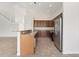 Kitchen with wooden cabinets, granite countertops, and stainless steel appliances at 3013 Silvermill Loop # O, Land O Lakes, FL 34638