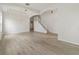 Open-concept living space with recessed lighting, staircase and light wood flooring at 3013 Silvermill Loop # O, Land O Lakes, FL 34638