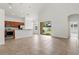 Open-concept living space features tile floors, high ceilings, and a kitchen with wood cabinets at 3013 Silvermill Loop # O, Land O Lakes, FL 34638