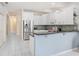 Stylish kitchen featuring stainless appliances, granite countertops, and mosaic backsplash at 30247 Emmetts Ct, Wesley Chapel, FL 33543