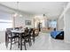 Open living space showcasing tile floors and dining area with lots of natural light at 30247 Emmetts Ct, Wesley Chapel, FL 33543