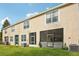 Exterior of the property with green grass at 30352 Elderwood Dr, Wesley Chapel, FL 33543