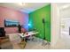 Bright living room with multicolored accent walls and a well-lit study area at 30352 Elderwood Dr, Wesley Chapel, FL 33543