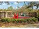 Community splash pad featuring colorful play elements and a secure perimeter fence at 30352 Elderwood Dr, Wesley Chapel, FL 33543