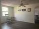 Inviting living room featuring durable floors and a classic rocking chair near a sunlit window at 3110 58Th N Ave, St Petersburg, FL 33714