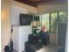 Porch area filled with a TV, stereo equipment, and other items at 3110 58Th N Ave, St Petersburg, FL 33714