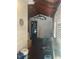 Covered porch with a mounted fish on the wall and lots of storage at 3110 58Th N Ave, St Petersburg, FL 33714