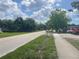 A peaceful street view with lush green trees and sidewalk at 3110 58Th N Ave, St Petersburg, FL 33714