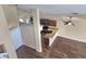 Open concept living space featuring kitchen view, hardwood floors, high ceilings and natural light at 31141 Harthorn Ct, Wesley Chapel, FL 33543