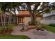 Fire pit and lush backyard landscaping, complete with outdoor living spaces at 3307 W Knights Ave, Tampa, FL 33611