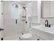 Bathroom featuring a glass enclosed shower, white cabinets, and black hardware at 3307 W Knights Ave, Tampa, FL 33611