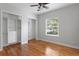 Bedroom features hardwood floors, a window with blinds, and closet at 3307 W Knights Ave, Tampa, FL 33611