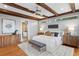 Bedroom with wood beam ceilings and side tables with lamps at 3307 W Knights Ave, Tampa, FL 33611