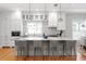 Modern kitchen with stainless steel appliances, granite countertops, and a large island with seating at 3307 W Knights Ave, Tampa, FL 33611
