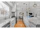 This kitchen boasts stainless steel appliances, an island with barstool seating, and a view to the dining room at 3307 W Knights Ave, Tampa, FL 33611