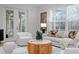 Well-decorated living room with natural light, comfortable furniture, and access to the outdoor area at 3307 W Knights Ave, Tampa, FL 33611