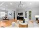 Stylish living space with hardwood floors, open layout to dining area, and comfortable seating at 3307 W Knights Ave, Tampa, FL 33611