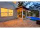 Enclosed lanai with a covered seating area, a ceiling fan and a sparkling blue pool at 3307 W Knights Ave, Tampa, FL 33611