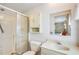 Bathroom featuring a shower, toilet, medicine cabinet and sink with a vintage design at 37812 Valencia Ave, Zephyrhills, FL 33541