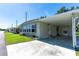 Attractive single-story home with a covered carport and well-maintained front lawn at 37812 Valencia Ave, Zephyrhills, FL 33541