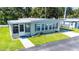 Well-kept single-story home featuring a neatly landscaped yard and a covered carport at 37812 Valencia Ave, Zephyrhills, FL 33541