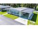 Well-maintained single-story home featuring a carport and landscaped front yard at 37812 Valencia Ave, Zephyrhills, FL 33541