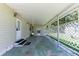 Covered patio area featuring a lattice fence and outdoor living space at 37812 Valencia Ave, Zephyrhills, FL 33541