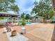 Spacious backyard with pool, outdoor seating, and adjacent pool house at 4002 Hudson Ter, Tampa, FL 33618