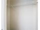 Walk-in closet with a single wire shelf providing efficient storage solutions at 4002 Hudson Ter, Tampa, FL 33618