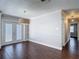 Dining area with French doors, stylish pendant lighting, and wood-look tile at 4002 Hudson Ter, Tampa, FL 33618