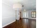Open dining area with wood-look tile flooring and stylish pendant lighting at 4002 Hudson Ter, Tampa, FL 33618