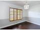 Dining room featuring custom window shutters, a chandelier, and neutral walls at 4002 Hudson Ter, Tampa, FL 33618