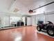 Spacious garage with laundry area and red ATV at 4002 Hudson Ter, Tampa, FL 33618