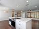 Open-concept kitchen featuring a large kitchen island with stainless steel microwave and cooktop appliances at 4002 Hudson Ter, Tampa, FL 33618